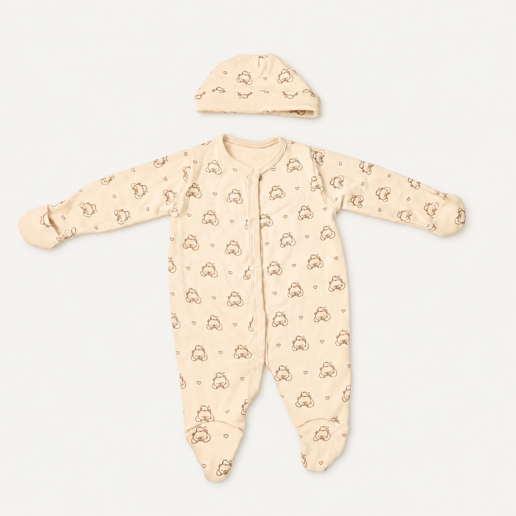 The Bear Footed Onesie with its matching hat, bear-and-heart print in off-white
