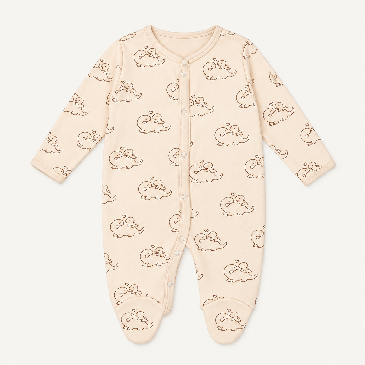 The Dino Footed Onesie, dinosaur-and-heart print in cream