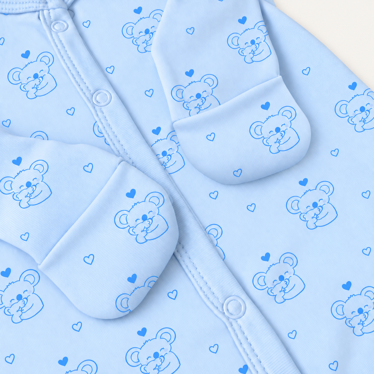 The Koala Footed Onesie, koala-and-heart print in blue