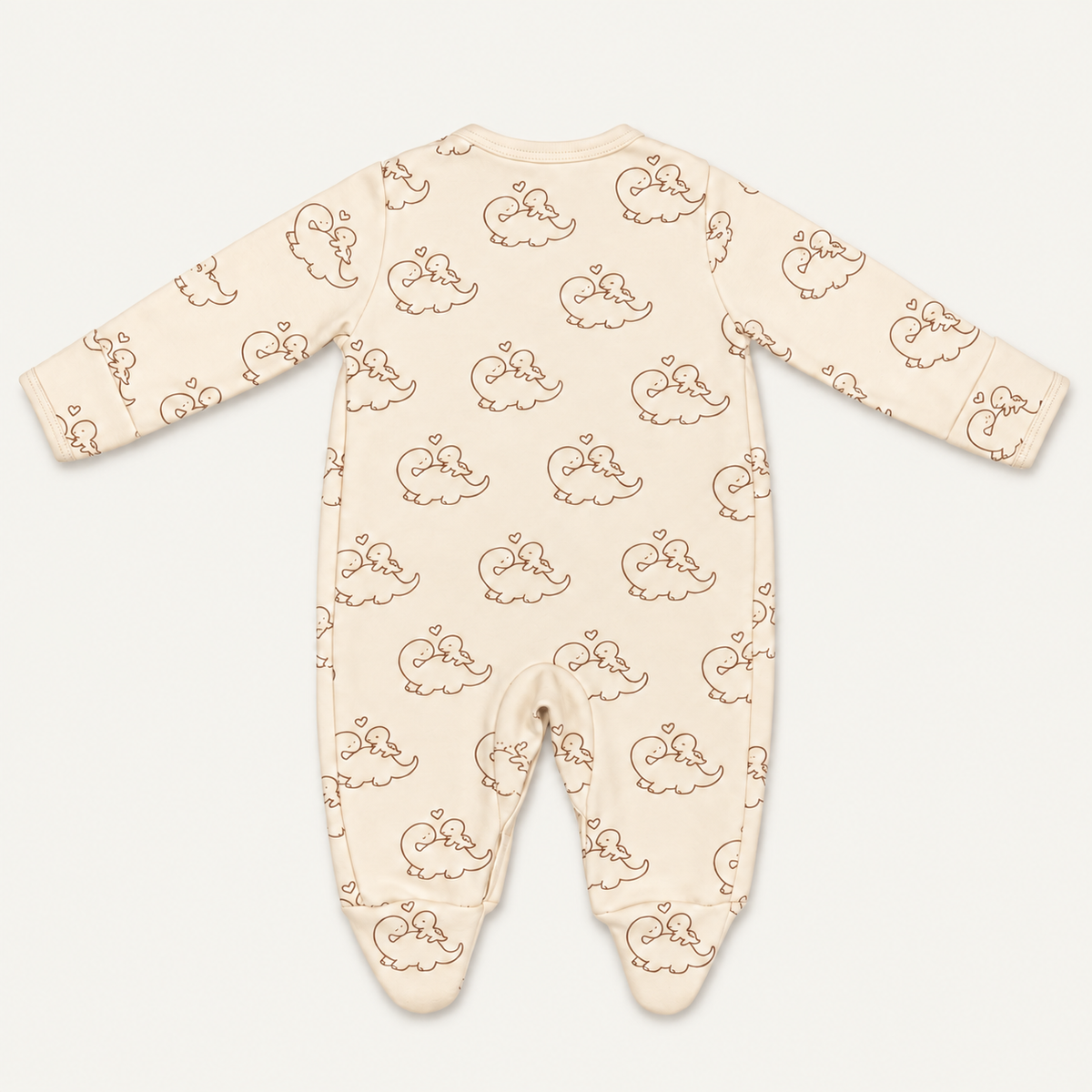 The Dino Footed Onesie, dinosaur-and-heart print in cream