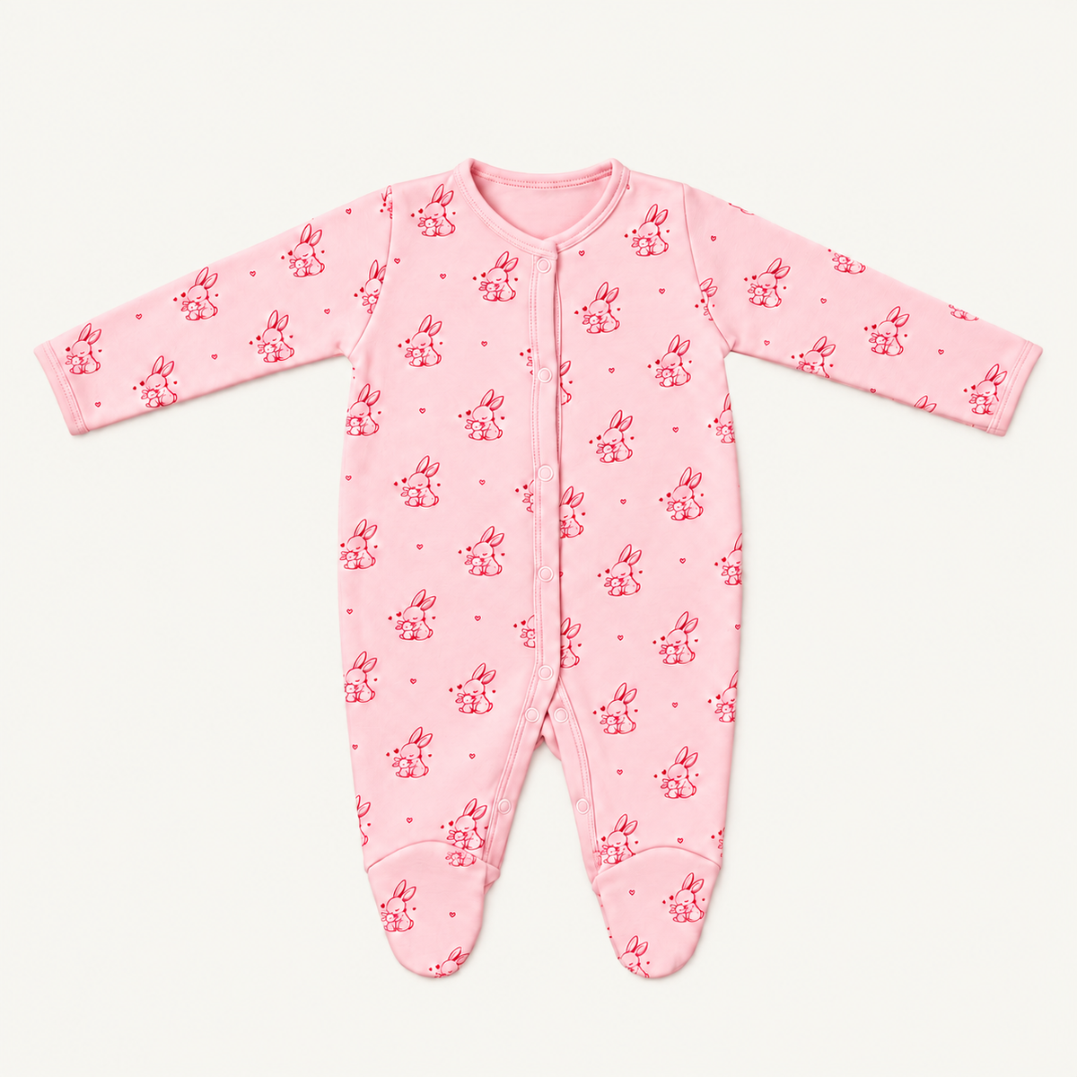 The Bunny Footed Onesie, bunny-and-heart print in pink